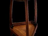 an image of a wooden table with a flower design on it