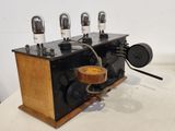 an old fashioned radio that is sitting on a table