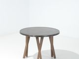 une table ronde avec deux pieds en bois et un plateau noir