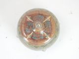 a small glass container with a decorative design on it