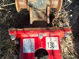 a red fire hydrant sitting in the middle of a field