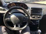 the interior of a car with a steering wheel and dashboard