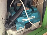 a blue and white blower sitting on top of a shelf