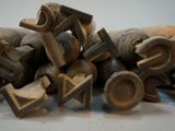 many pieces of wood that are sitting on a table