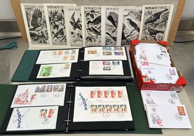a lot of stamps on a table with a lot of folders
