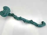 a close up of a metal hook with a heart on it