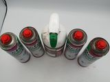 several cans of paint are arranged in a circle on a white surface