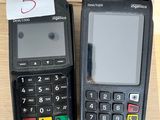 two cell phones sitting next to each other on a table
