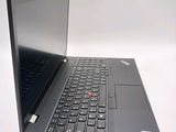 a black laptop with a silver keyboard on a white surface