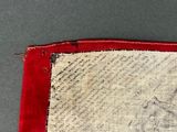a close up of a piece of cloth with a red border