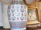 a lamp that is sitting on a table with a lamp shade on it