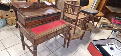 a table and chairs in a room with a lot of furniture