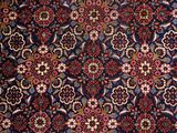 a close up of a rug with many different designs on it