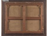a close up of a wooden frame with a window in it