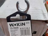 a box with a wrench on top of it and a carton of boxes in the background