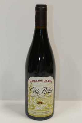 a bottle of wine that is sitting on a table