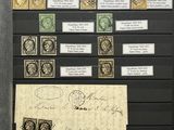 a picture of a collection of stamps on display in a glass case