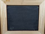 a picture of a blackboard in a wooden frame