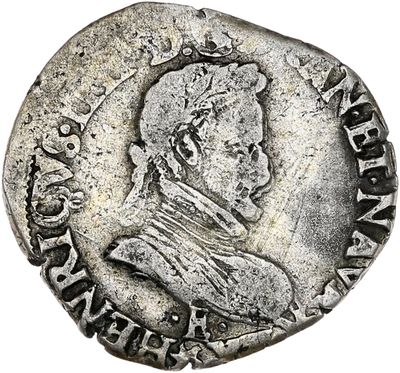 une pièce d'argent portant l'image d'un homme