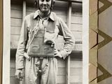 a black and white photo of a man in a pilot ' s outfit