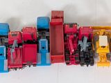 a lot of toy trains that are lined up together