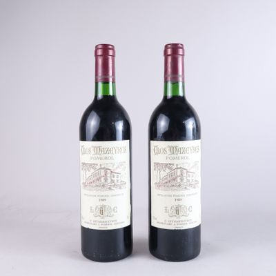 deux bouteilles de vin rouge posées l'une à côté de l'autre sur une table