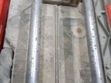 a close up of a piece of metal on a red cart