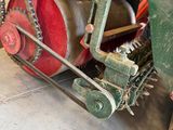 a red and green machine that is sitting on the floor