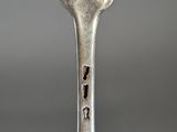 a fork that has a hole in the middle of it