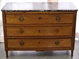 a wooden chest of drawers with a marble top