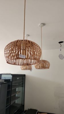 three lamps hanging from the ceiling in a living room