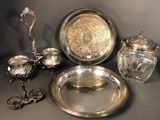 a lot of silver items that are on a table
