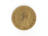 une pièce d'or avec l'image d'une femme dessus