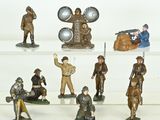 many figurines of soldiers on display on a shelf