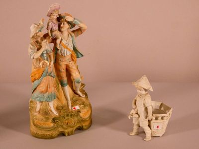 two figurines that are sitting next to each other