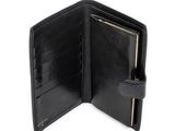 the black leather wallet is open and ready to be used