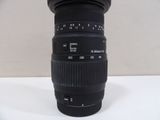 a black camera lens sitting on a white table