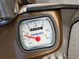 a close up of a speedometer on a motor scooter