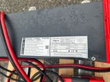 a close up of a red and black battery box