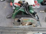 someone is using a circular saw to cut a piece of metal