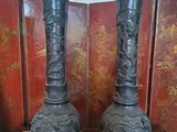 two vases that are sitting on a table