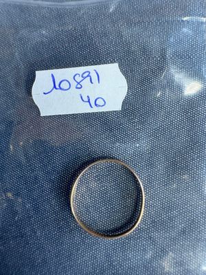 a ring that has been placed on a piece of paper