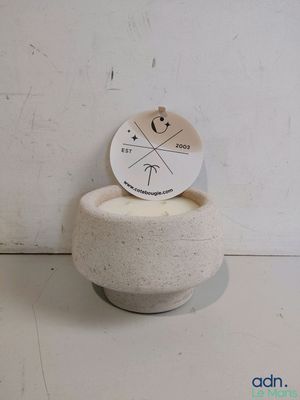 a small white bowl with a sticker on top of it