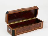 a small wooden box that is open on a white surface