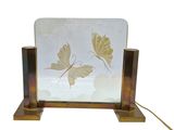 a mirror with a picture of a butterfly on it