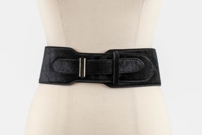 the belt is black and has a metal buckle on it
