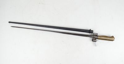 a close up of a sword on a table with a white background