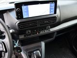 a car dashboard with a steering wheel and a dash board
