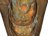 bronze statue of a woman holding a snake in her hands