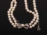 a pearl and diamond necklace and bracelet set